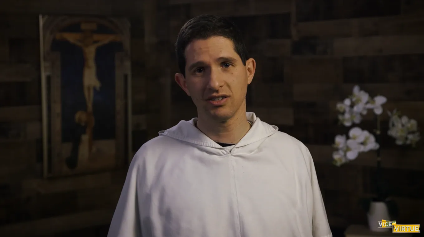 Dominican Priest speaking to the camera with concerned look on his face.
